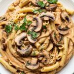 Creamy vegan hummus pasta recipe tossed with mushrooms