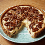 Indulge in the creamy richness of Pecan Cheesecake Pie, a delightful dessert that will amaze your taste buds!
