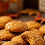 Maple pumpkin cookies with glossy maple glaze showing soft texture and fall colors