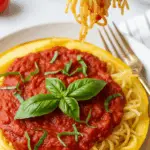 Air fryer spaghetti squash served with marinara sauce as healthy pasta alternative