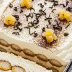 Earl Grey tiramisu slice showing cream layers and ladyfinger base with garnish